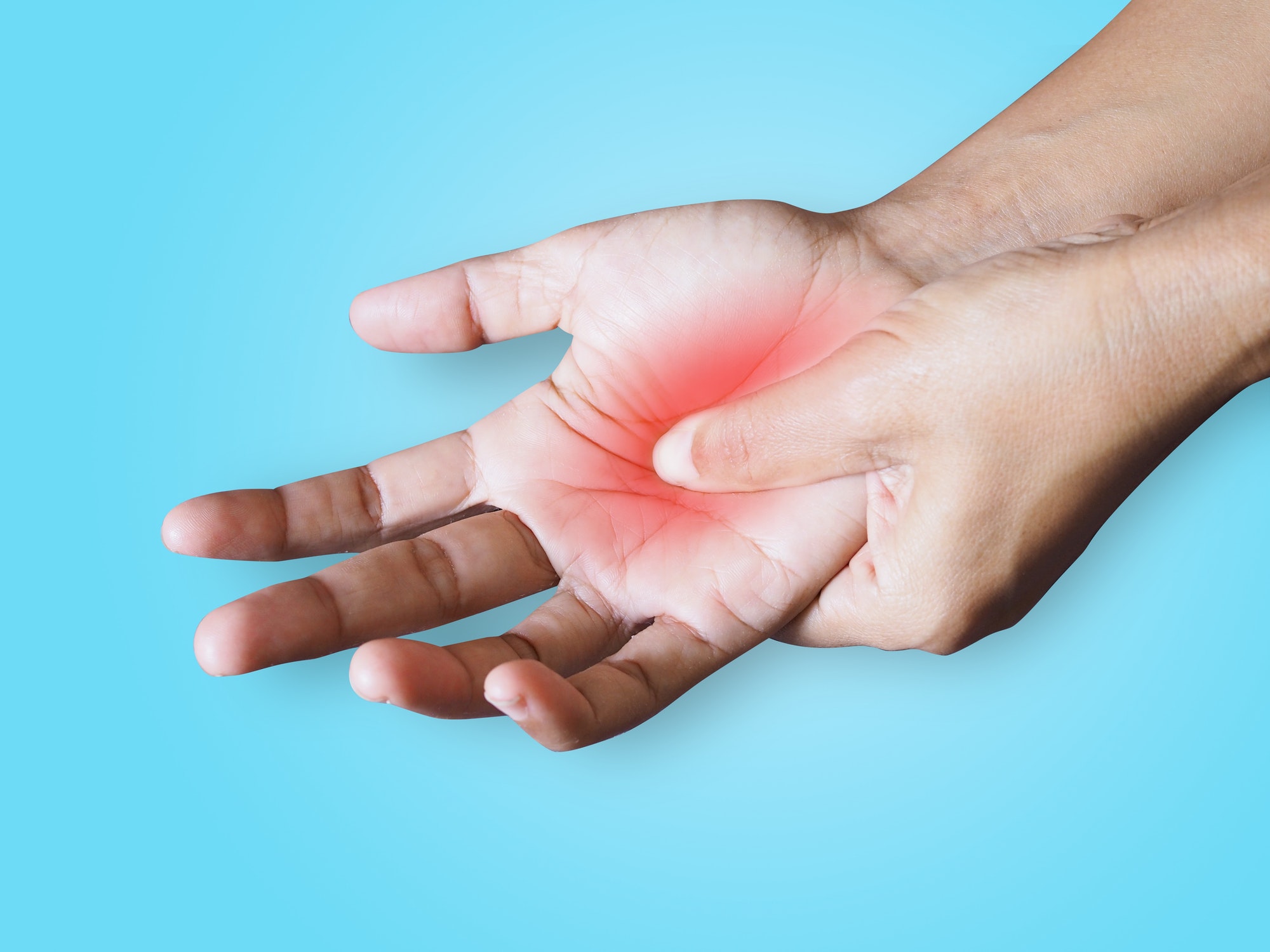 Woman suffering with chronic hand pain